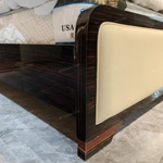 Cream Leather Upholstered Bed with Dark Natural Wood Veneer Trim, Embossed Brand Emblem & Copper-Accented Hardware